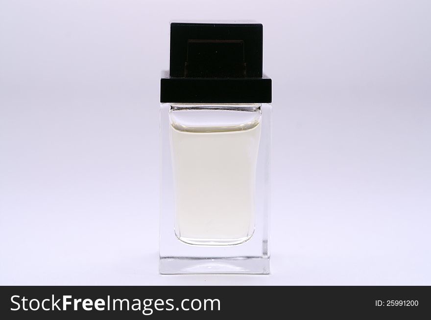 A picture of a bottle of perfume with white background.