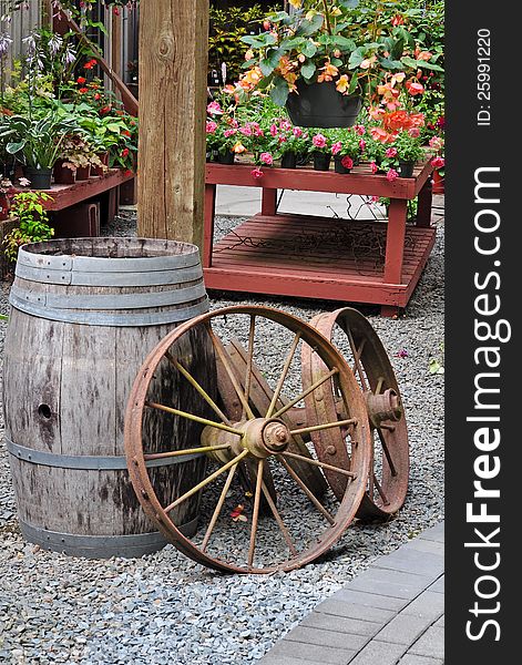 Garden shop with old barrel and wagon wheels on display