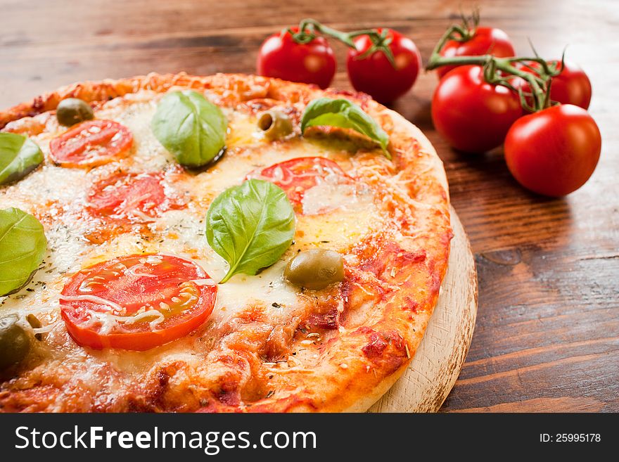 Italian pizza with tomatoes and basil. Italian pizza with tomatoes and basil