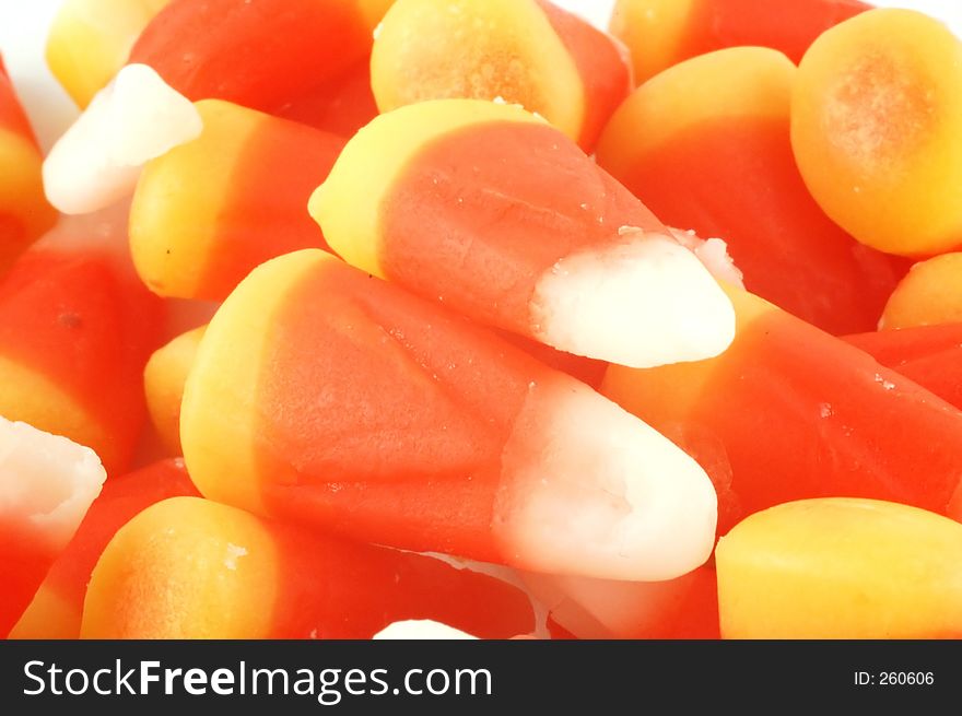 A close-up of a pile of candy corn. A close-up of a pile of candy corn