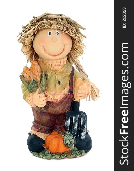 Country scarecrow with corn and pumpkin wearing straw hat.