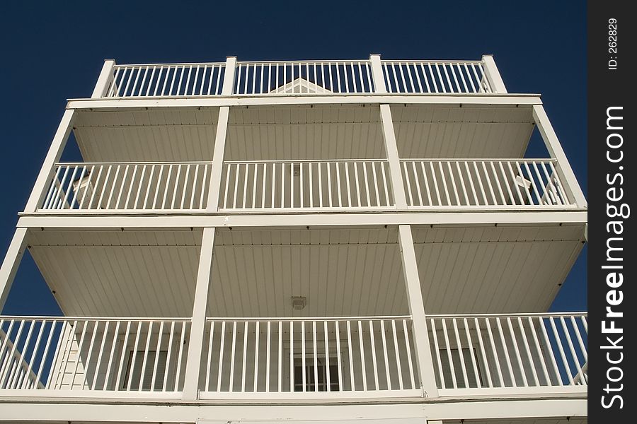 This is a composition of some white balconies on a small hotel in Ocean Grove NJ.