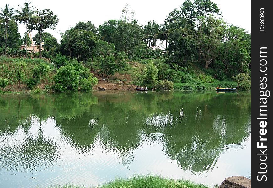 A beautiful scene of a greenery and reflection of water In Indian village. A beautiful scene of a greenery and reflection of water In Indian village.