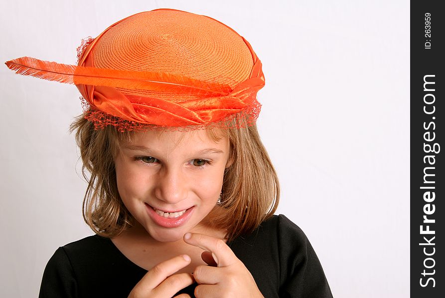 Young smiling girl with orange women's hat on