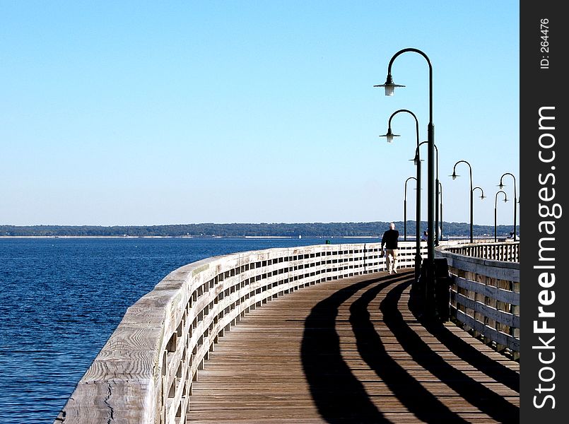 Walking the pier with shadows