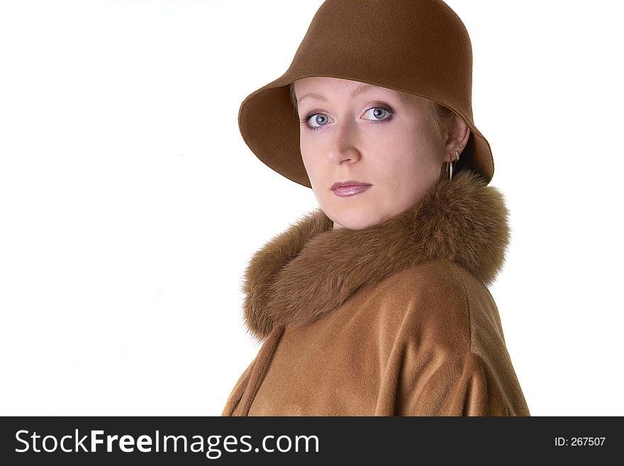 Elegant lady in hat and coat with fur