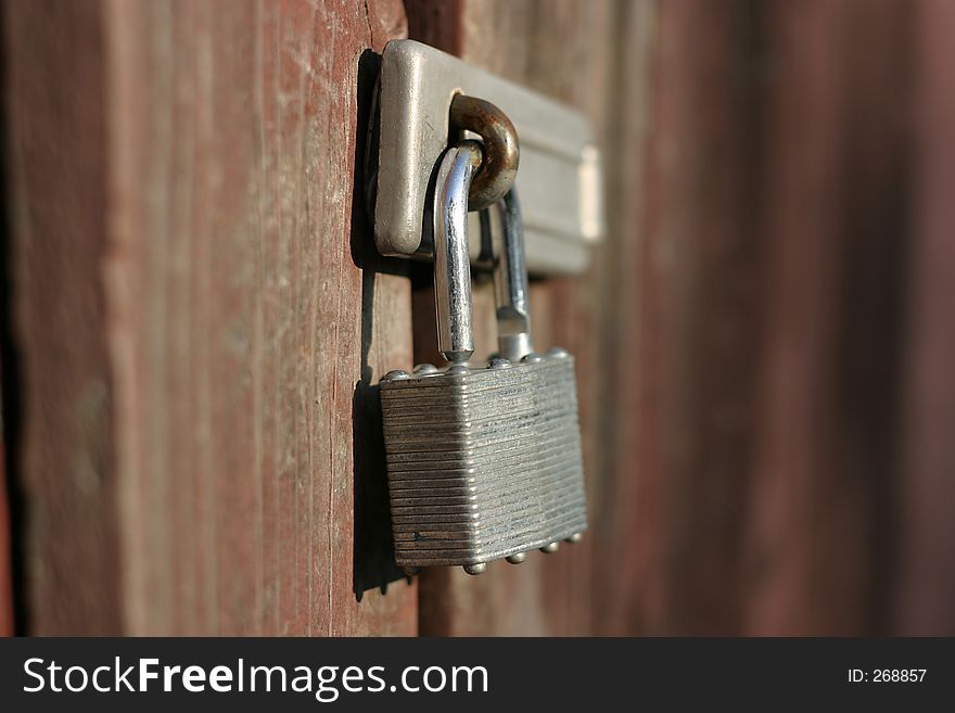 Metal lock on wooden gate