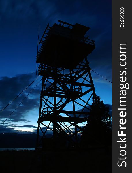 Fire Tower silhouetted against blue sky - dusk/sunset