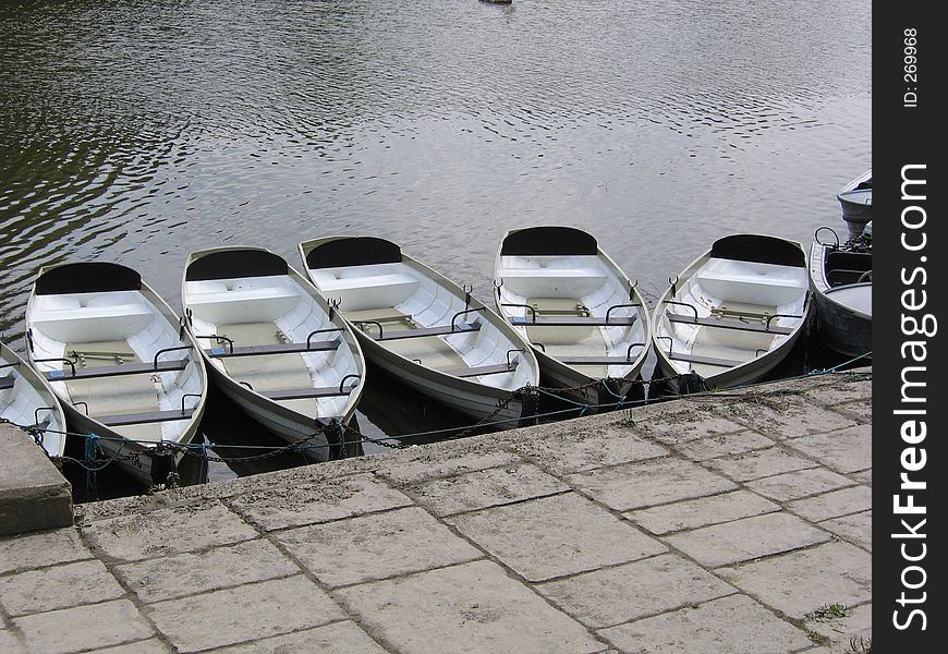 Rowing Boats moored on the River Dee at Chester. Rowing Boats moored on the River Dee at Chester