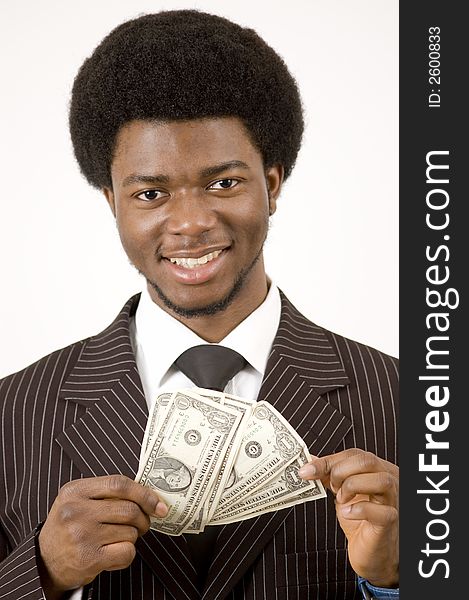 This is an image of businessman smiling while holding some money. This image can be used to represent prosperity themes. This is an image of businessman smiling while holding some money. This image can be used to represent prosperity themes.