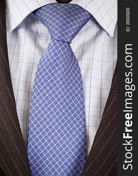 This is a close up of businessman wearing a tie, shirt, and suit. This is a close up of businessman wearing a tie, shirt, and suit.