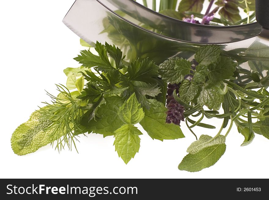 Fresh herbs and mezzaluna. isolated on the white background. Fresh herbs and mezzaluna. isolated on the white background