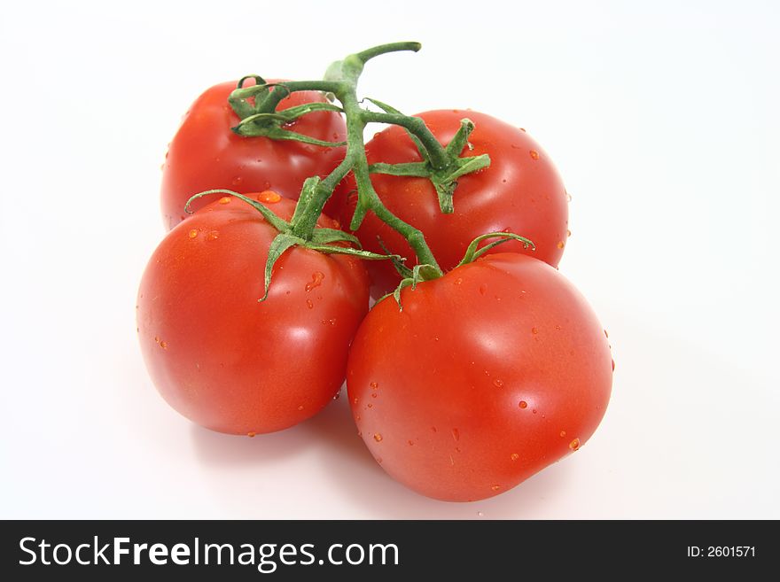 Red juicy tomatoes isolated