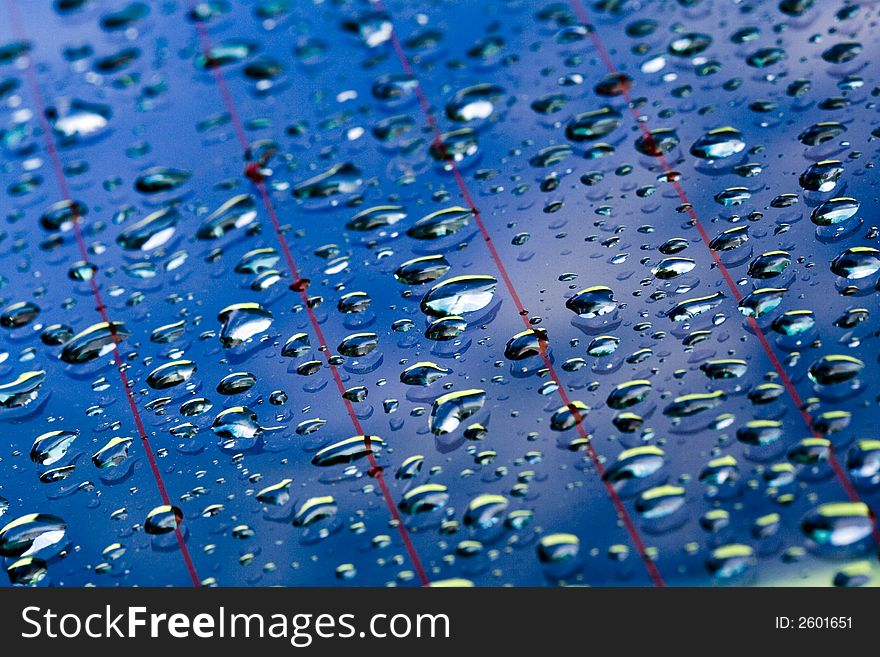 Water droplets in blue window surface. Water droplets in blue window surface