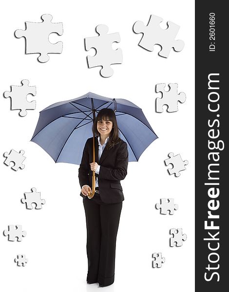 Young businesswoman with umbrella and puzzle pieces isolated in white background. Young businesswoman with umbrella and puzzle pieces isolated in white background