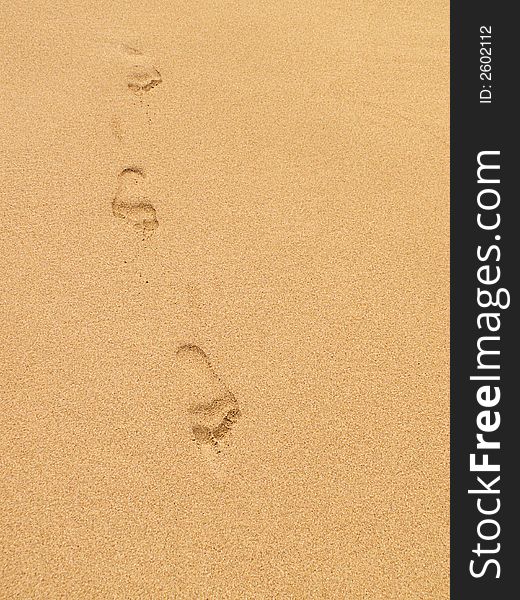 Footsteps in the sand of tropical tan beach. Footsteps in the sand of tropical tan beach.