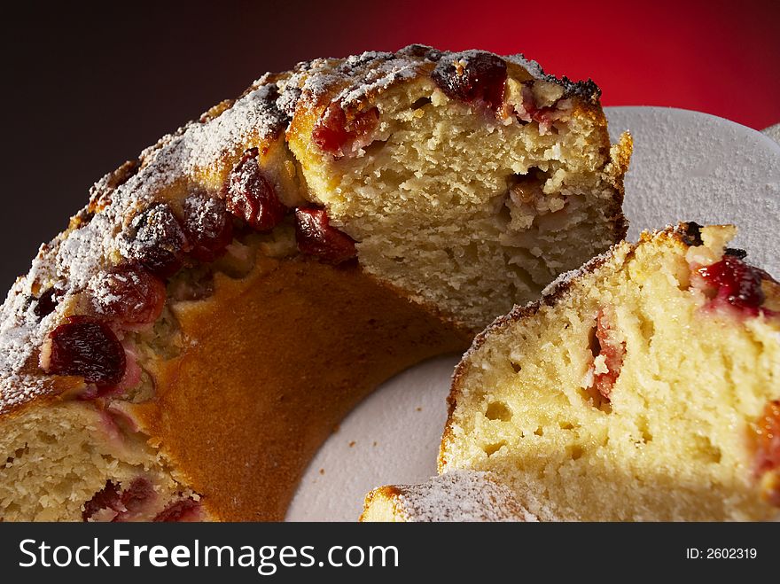 Fresh baked cake with sugar and raisin