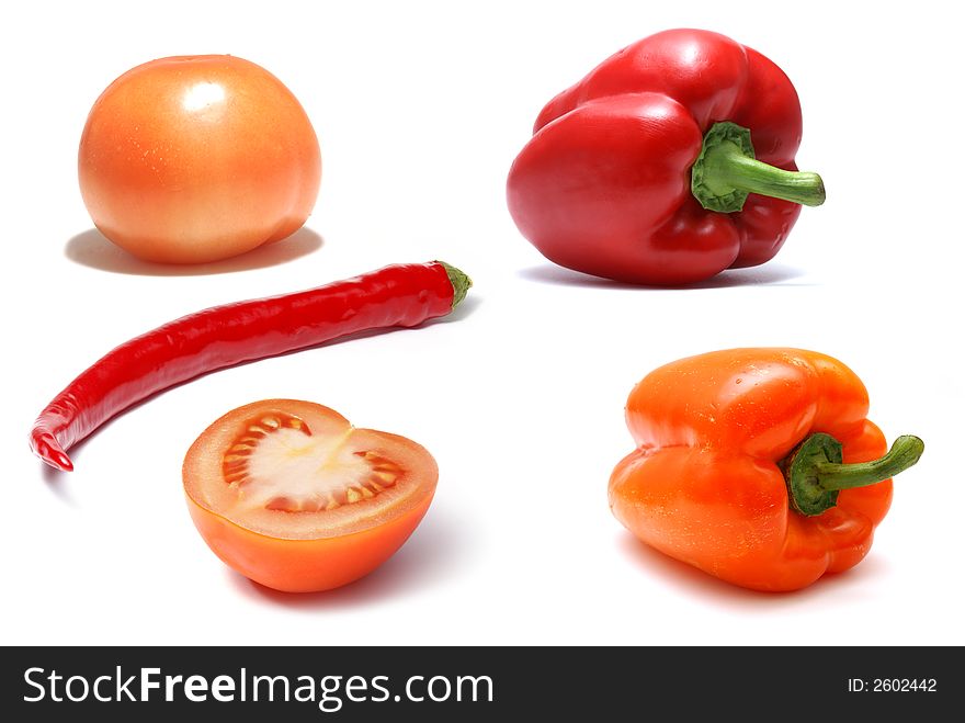 Paprika and tomatoes isolated on white. Paprika and tomatoes isolated on white