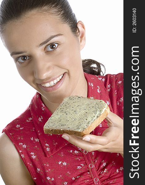 Woman eating slice of bread. Woman eating slice of bread