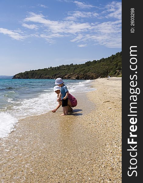 Ma With Child On Beach