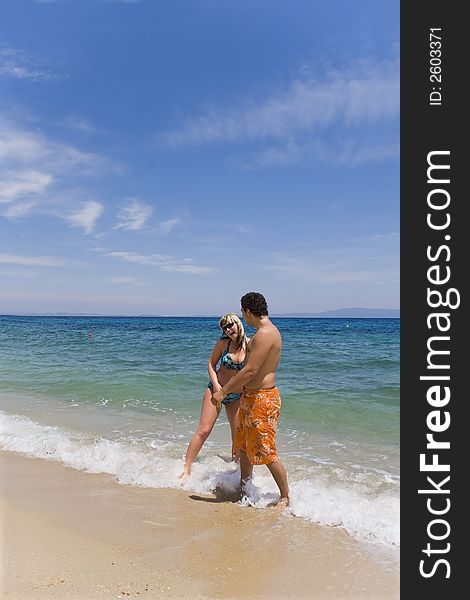 Young people on seacoast, beach