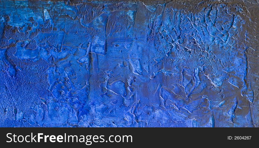 Word blue printed on abstract blue painting, painting was created by photographer