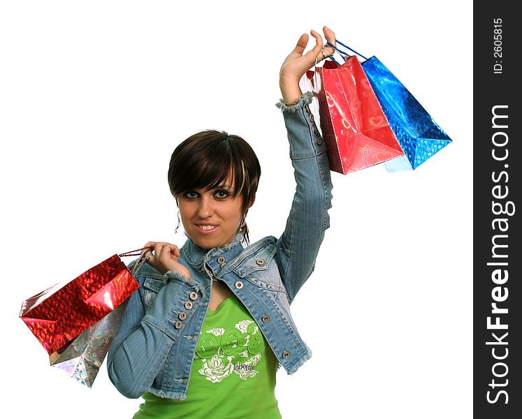 The happy girl with purchases, on a white background