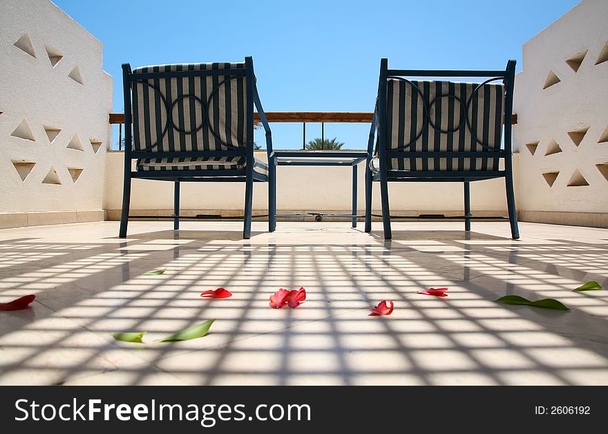 Chairs on a balcony on the tropical resort