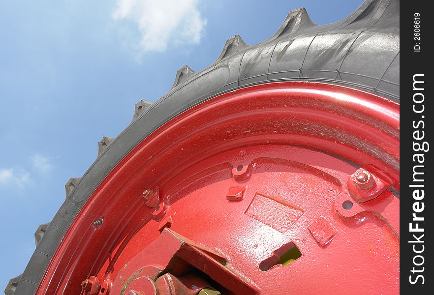 The giant wheel of a farm tractor. The giant wheel of a farm tractor