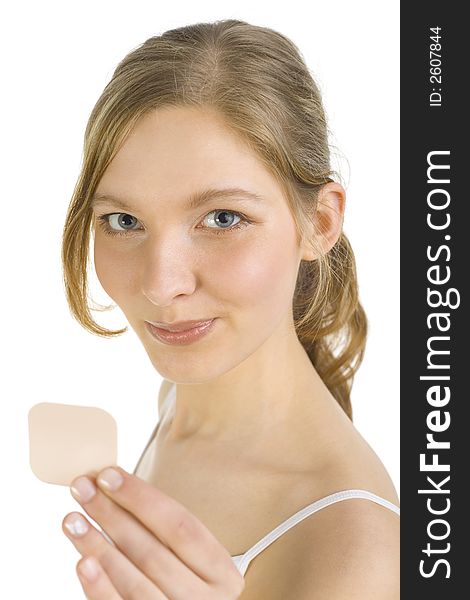 Young smiling woman holding and showing contraception patch. Looking at camera. Young smiling woman holding and showing contraception patch. Looking at camera