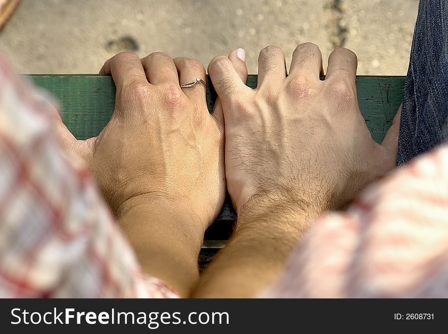 Two hands holding together in color. Two hands holding together in color