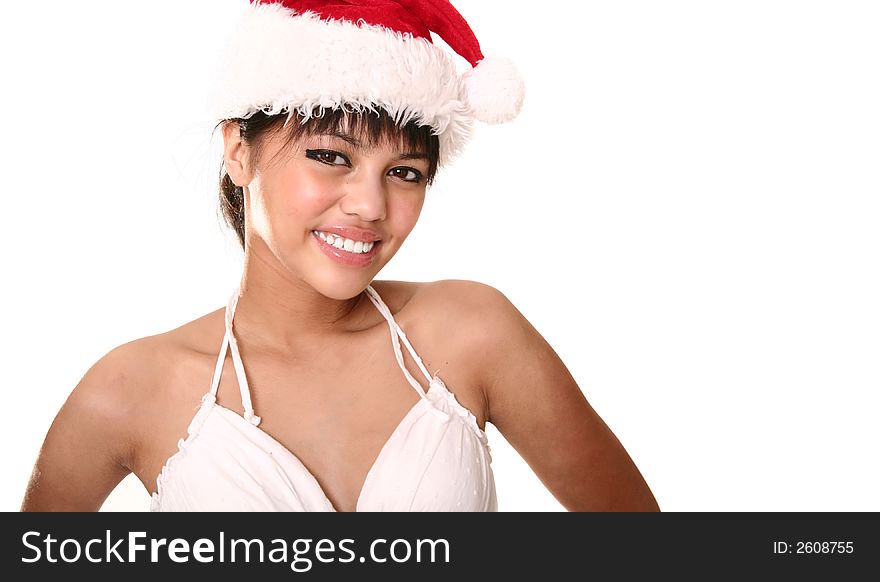 Close up beautiful brunette wearing christmas hat. shot with rim light isolated on white