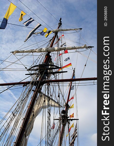 Mast & flags against blue sky