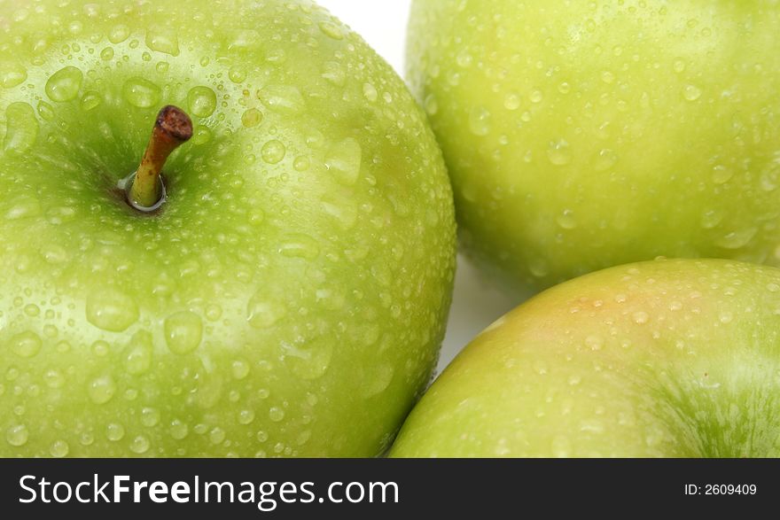 Green wet apples' background over white. Green wet apples' background over white