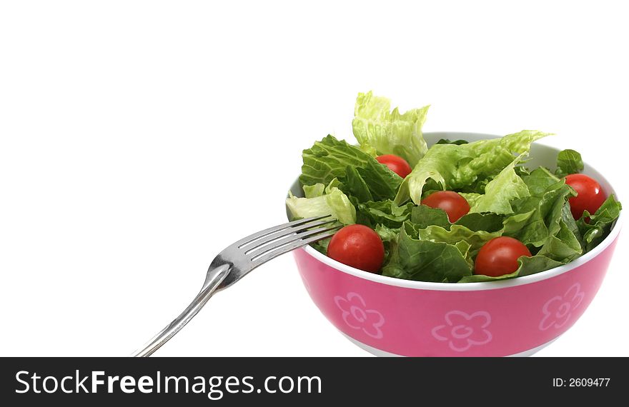 Green salad with cherry tomatoes over white background