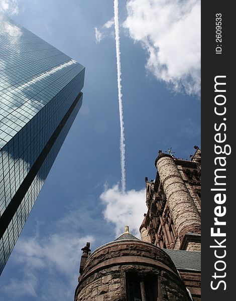 Between the John Hancock Building and Trinity Church. Between the John Hancock Building and Trinity Church.