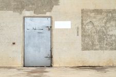 Concrete Wall With Metal Door Stock Photos