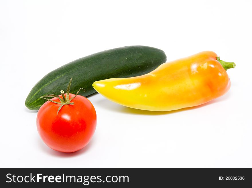 Tomato, paprika and cucumber isolated on white. Tomato, paprika and cucumber isolated on white
