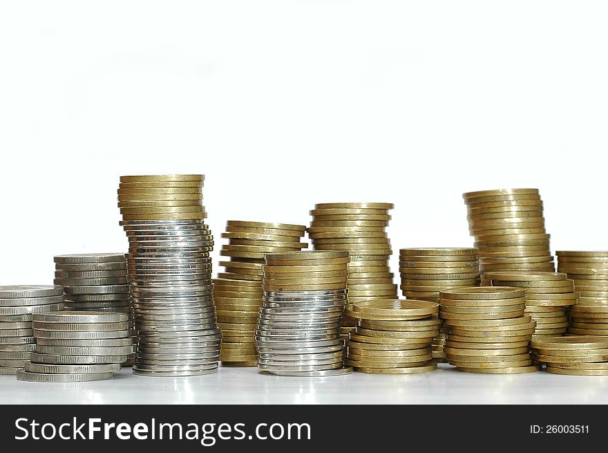 Stack of coins on white background. Coins from Indonesia.