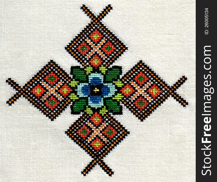 Handmade embroidery on the fabric cross threads