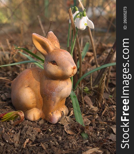 An easter bunny made of ceramic.