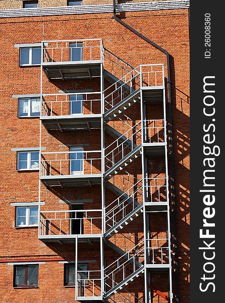 Metal Ladder At The Wall Of The House