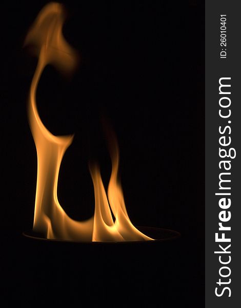 Fire in a bowl on a black background. Fire in a bowl on a black background