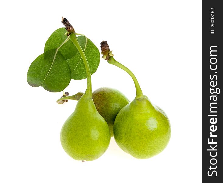 Three pears with leaves separately on a white