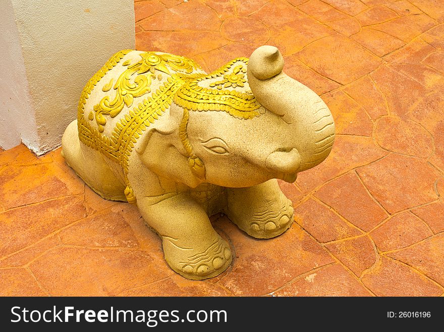 Stone elephant statue on outdoor clay tiles