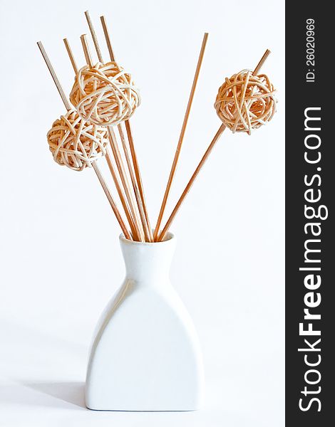 Aromatic diffuser with ornamental bamboo sticks.