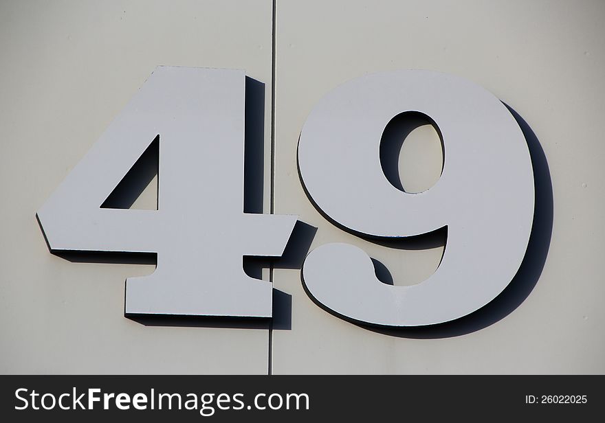The large numerals have been sculpted in grey metal and stand out clearly on the grey background. The large numerals have been sculpted in grey metal and stand out clearly on the grey background.