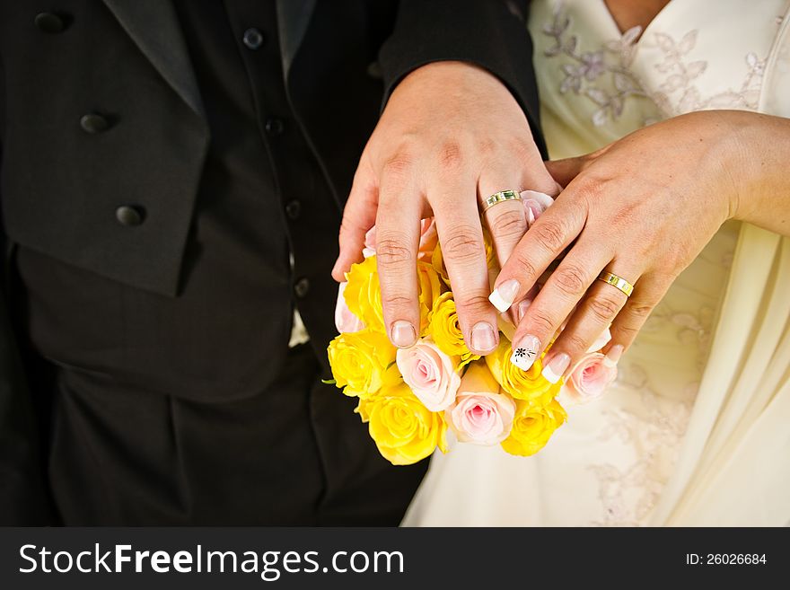 Wedding rings and bouquet.