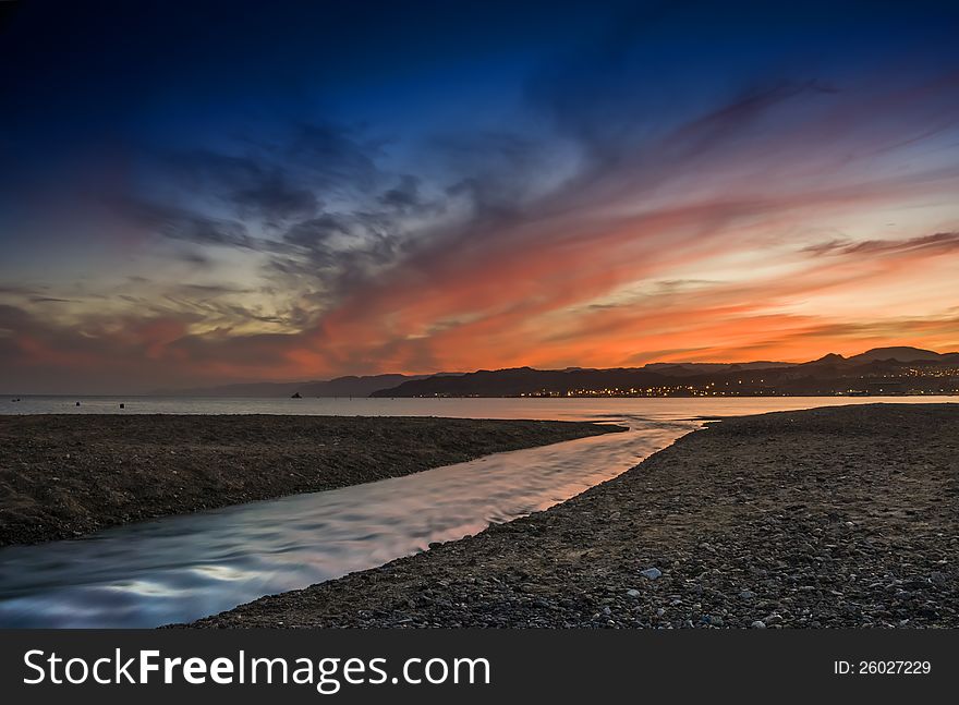 Colorful sunset at the Red Sea, northern beach of Eilat - famous resort city of Israel