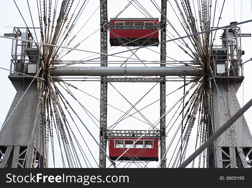 Closeup of famous Ferris wheel against blue sky with clouds in Prater Park, Vienna, Austria